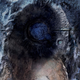 Promotional art for the Next Mass Effect, showing a crater in the shape of a Geth face.